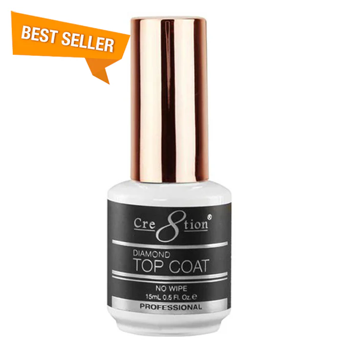 A bottle of Cre8tion Diamond No Wipe Top Coat 0.5oz, featuring a rose gold cap and "BEST SELLER" label. The bottle contains 15ml (0.5 fl. oz.) of professional top coat.