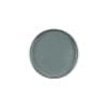 A round plate with a smooth, gray surface viewed from above, reminiscent of the sleek finish of GiGi Charcoal Detox Facial Hair Removal Wax.