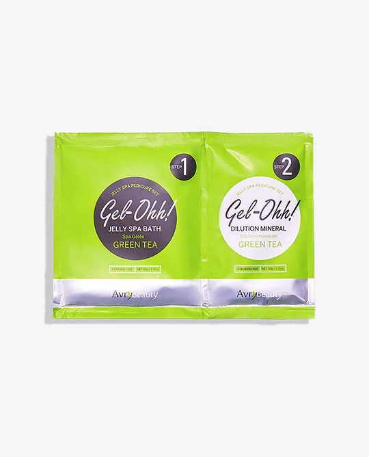 Two green tea bags on a white background with Gel-Ohh Jelly Spa Pedi Bath Case.