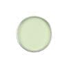 A top-down view of an open paint can filled with light green paint, resembling the soothing hue of GiGi Tea Tree Creme Wax.