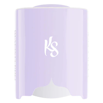 A lilac-colored automatic soap dispenser with the initials "KS" in white on the front, designed to complement your Kiara Sky rechargeable LED lamp.