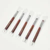 Five KYE French Brush with Dotting Tool in plastic packaging on a white surface.