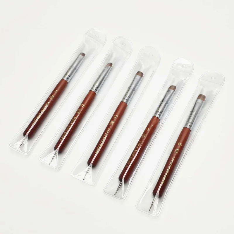 Five KYE French Brush with Dotting Tool in plastic packaging on a white surface.