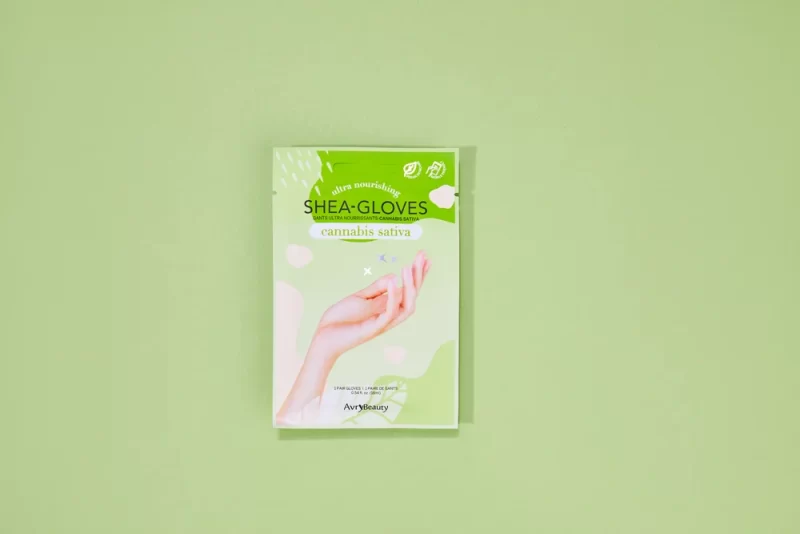 A package featuring AvryBeauty CBD Gloves Single, with a hand on it, on a green background.