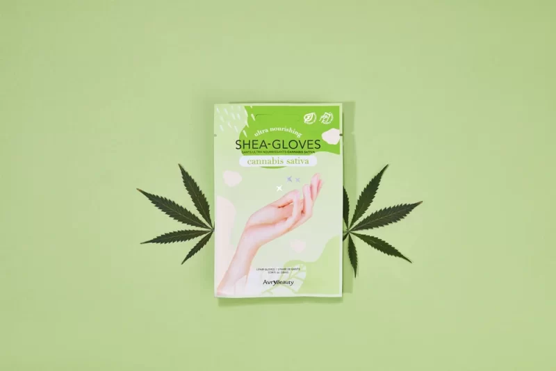 AvryBeauty CBD Gloves Single on a green background.