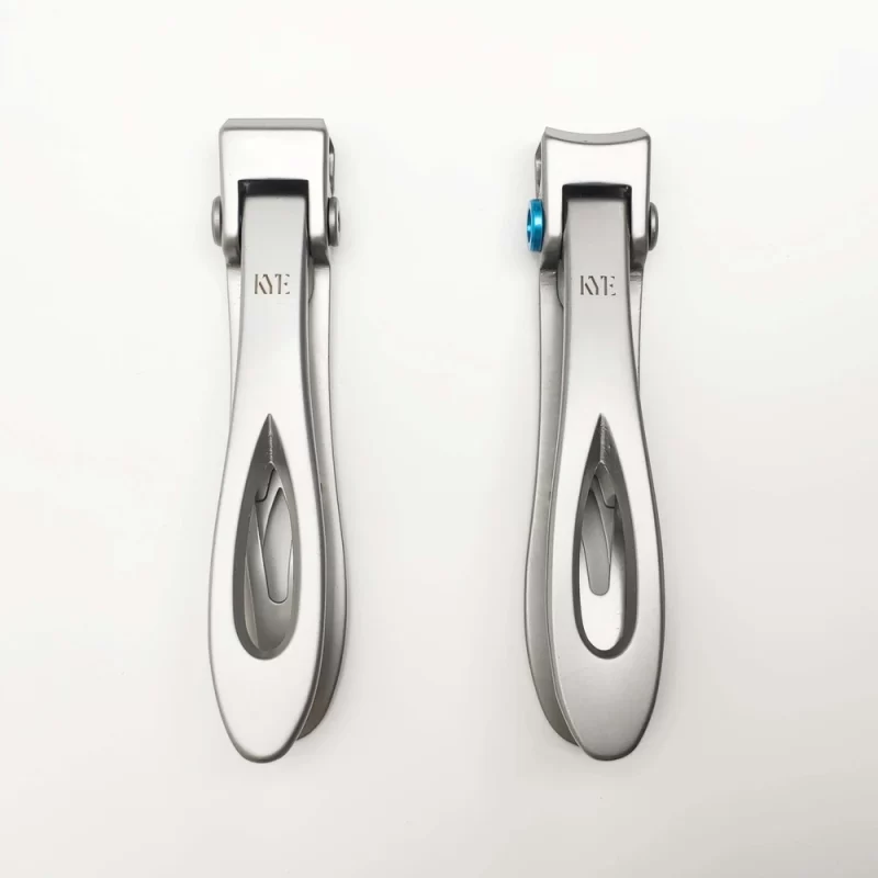 A pair of KYE Wide Jaw Toe Nail Clippers on a white surface.