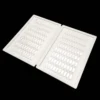The Acrylic Nail Art Color Chart Display Book comes with a white tray featuring numerous holes.