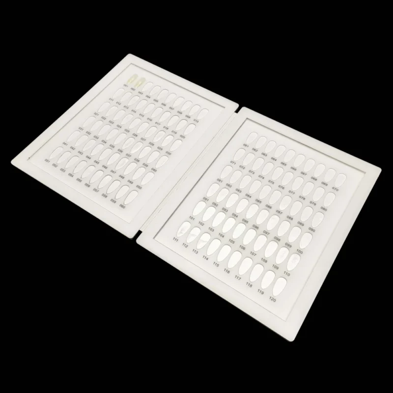 A white tray with a number of holes on it, ideal for displaying an Acrylic Nail Art Color Chart Display Book.
