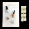 The Acrylic Nail Art Color Chart Display Book featuring nail polishes and nail clippers.