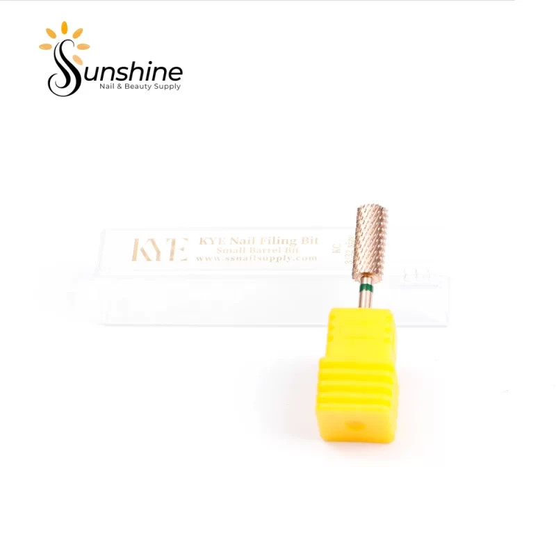 A KYE Premium Bit Small Barrel 5.35mm with a yellow mandrel on a white surface, with its packaging in the background displaying "nail filing bit" and "sunshine nails".