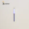 Nail brush with a white bristle head and a blue glitter handle on a solid background, with the "Sunshine Nails & Beauty Supply" logo featuring Ceramic Bit Volcano 5-in-1 in the corner.