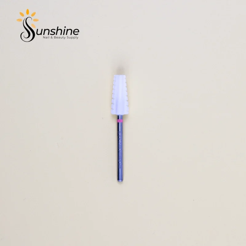 Nail brush with a white bristle head and a blue glitter handle on a solid background, with the "Sunshine Nails & Beauty Supply" logo featuring Ceramic Bit Volcano 5-in-1 in the corner.