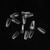 Clear glass vials scattered on a black background, showcasing KYE Soft Gel Refill Tips - Long Coffin (50pcs/Bag).