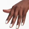 A person's hand with white polished nails enhanced by OPI Nail Envy Tri-Flex Technology 0.5oz against a white background.