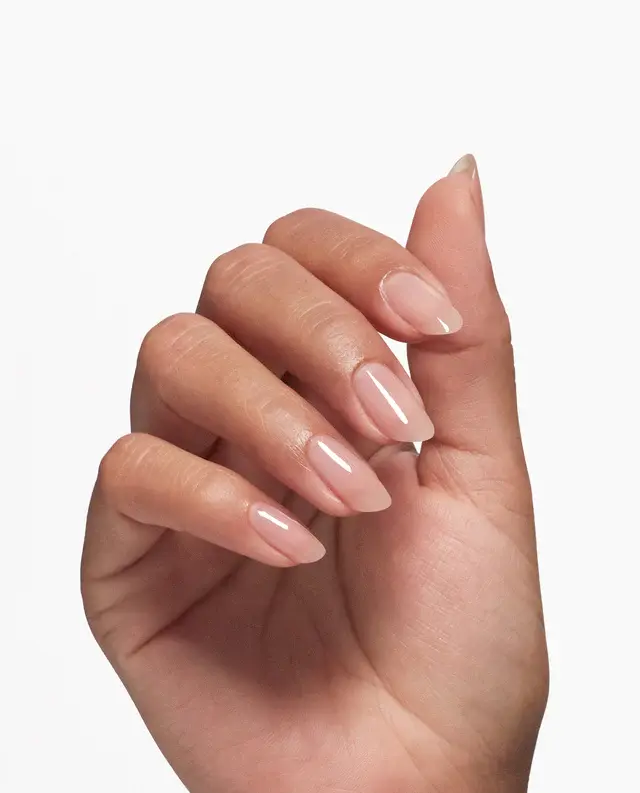 Sentence with product name: A hand with neatly manicured and polished fingernails, enhanced by OPI Nail Envy Tri-Flex Technology 0.5oz for superior strength and flexibility.