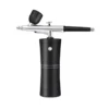 Portable mini airbrush system mounted on a black air compressor.