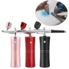 Portable Mini Airbrush System for makeup and cosmetic application with a close-up inset showing the Belletouch Portable Mini Airbrush System in use.