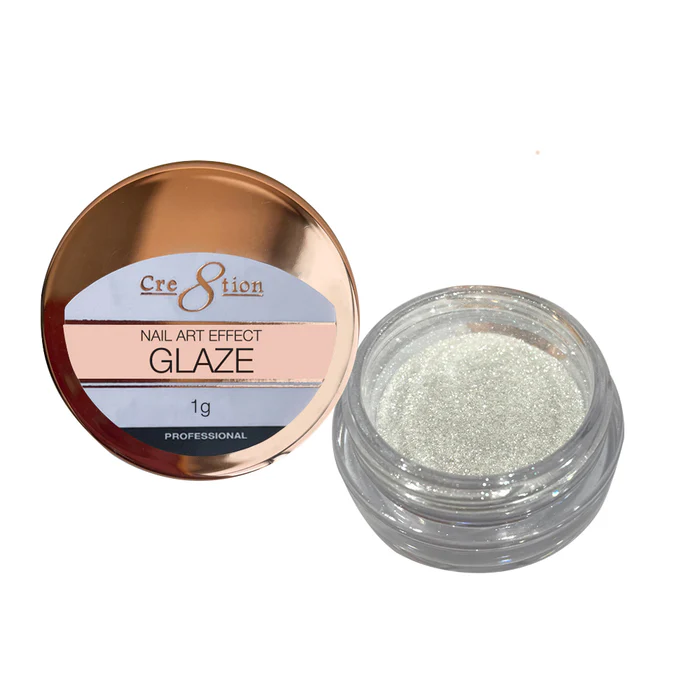 A small jar labeled "Cre8tion Nail Art Effect GLAZE 1g" containing 1g of shimmering glaze powder with its clear lid removed, perfect for adding a touch of sparkle to your nail art.