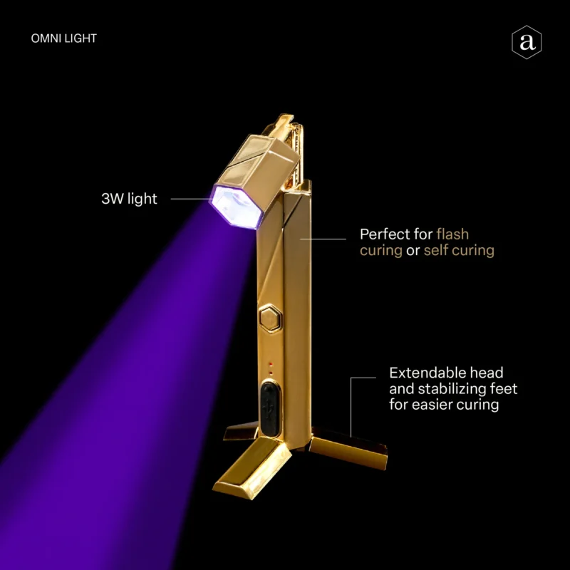 A portable 3w Apres Gel-x Flash Cure Omni Light Gold featuring an extendable head and stabilizing feet, suitable for flash curing or self-curing applications.