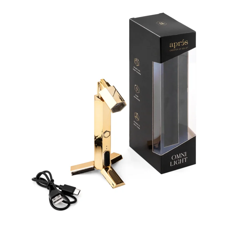 Apres Gel-x Flash Cure Omni Light Gold desk lamp with USB cable and product packaging.