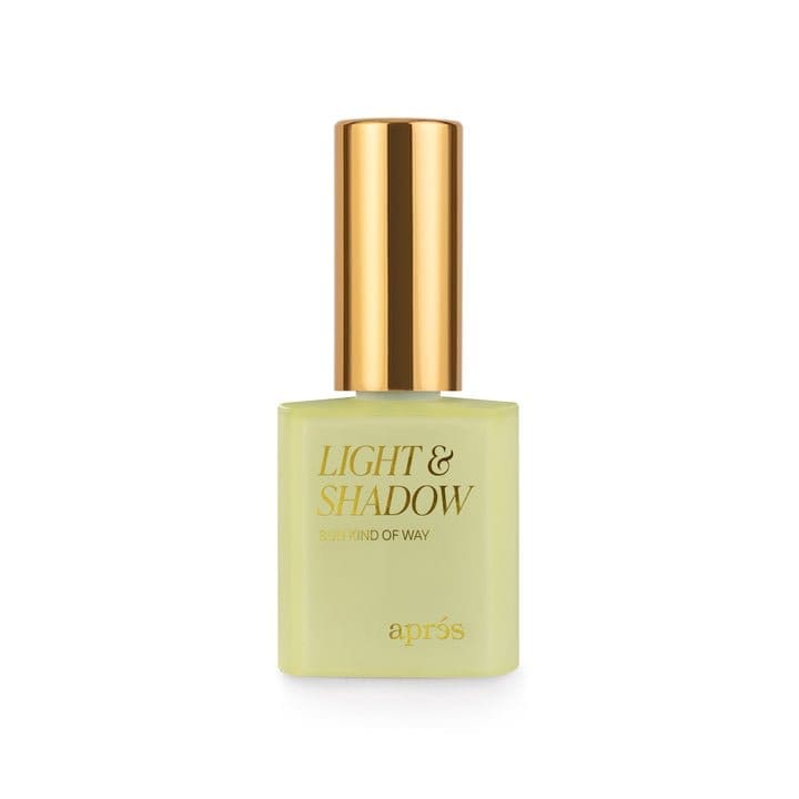 A 10ml bottle of nail polish labeled "Apres Light & Shadow Sheer Gel Collection 10ml" by Après, with a golden cap.