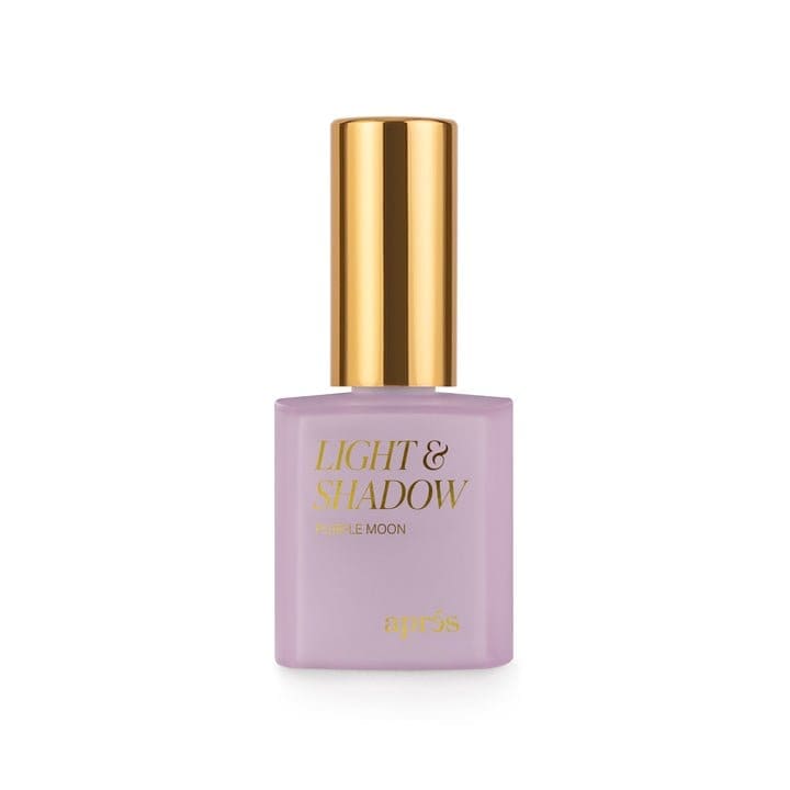 A bottle of Apres Light & Shadow Sheer Gel Collection 10ml nail polish in the shade "Purple Moon," featuring a gold cap and a lavender-colored bottle.