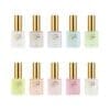 Ten bottles of Apres Light & Shadow Sheer Gel Collection 10ml with gold caps, each labeled "Light & Shadow" by Apres, displayed in two rows. They showcase a range of colors including white, yellow, blue, pink, green, and pastel shades. The collection includes Sheer Gel options for a sophisticated finish.