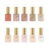 A set of ten bottles of Apres Light & Shadow Sheer Gel Collection 10ml with gold caps, each labeled "Light & Shadow" by Après, featuring a range of colors from dark red to light pink and beige.