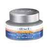 A container of IBD Hard Gel/Builder Gel 0.5oz Clear, labeled 14g/0.5 oz, intended for nail enhancement.