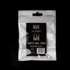 A sealed package containing nail extensions labeled "KYE Soft Gel Refill Tips - Medium Almond (50pcs/Bag)." The package is transparent with a black and white label.