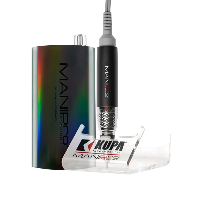 Introducing the ManiPro Passport Limited Edition Moonlight Unicorn: a portable electric nail drill featuring a sleek black handpiece, a metallic base shimmering with a Moonlight Unicorn sheen, and a clear stand. Branded with "MANIPro" and "Kupa Incorporated," this is your ultimate stylish nail care solution.