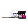 A small UV nail lamp, a double-sided eyeshadow box with pink and beige shades, and a makeup brush from the Gelish Solid Cream Gel Polish Starter Kit - BOLD are arranged on a white surface.