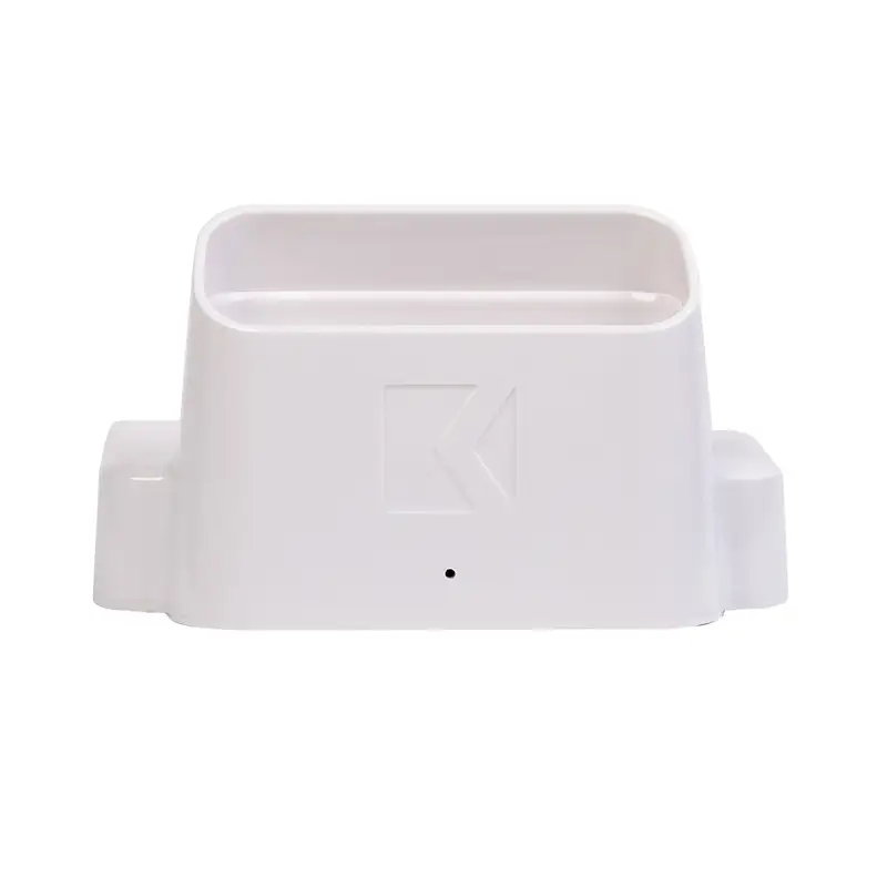 The ManiPro Passport Next Complete White plastic holder, featuring an embossed logo in the center, comes in a rectangular shape with two side extensions.