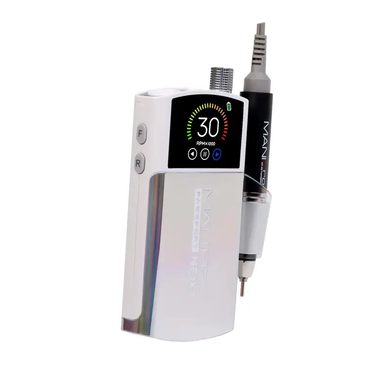 The compact ManiPro Passport Next Complete White handheld device features a digital screen displaying "30 RPM 10000" and two buttons labeled "F" and "R." Additionally, a connected instrument is attached to the side of the device.