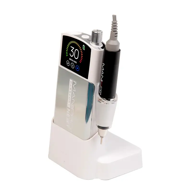 The ManiPro Passport Next Complete White professional electric nail drill, featuring a digital display and control knob, rests elegantly on a matching stand with an attached handle, providing the perfect passport to flawless nails.