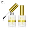 Two 0.5oz bottles of KYE Crystal Top Finish, one with an open cap and applicator brush, featuring gold accents. It is compatible with the KYE Rubber Base 0.5oz (NO HEMA) for a safer application experience.