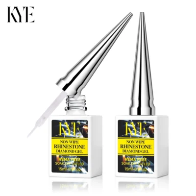 Two bottles of KYE Non Wipe Rhinestone Diamond Gel and KYE Rubber Base 0.5oz (NO HEMA), each featuring a shiny silver pointed cap, offer a 15ml (0.5 fl oz) capacity. The NO HEMA formula guarantees safety and quality in every application.