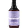 Enjoy the calming essence of Voesh Vegan Hand & Body Creme 28oz. This bottle, equipped with a pump dispenser and lavender-themed label, delivers a luxurious blend of moisture and relaxation for your skin.